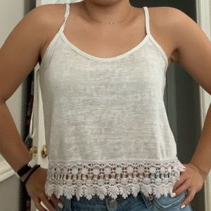 Cute white tank with lace type on the bottom